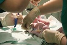 A newborn receives an injection of vitamin K after cesarean section